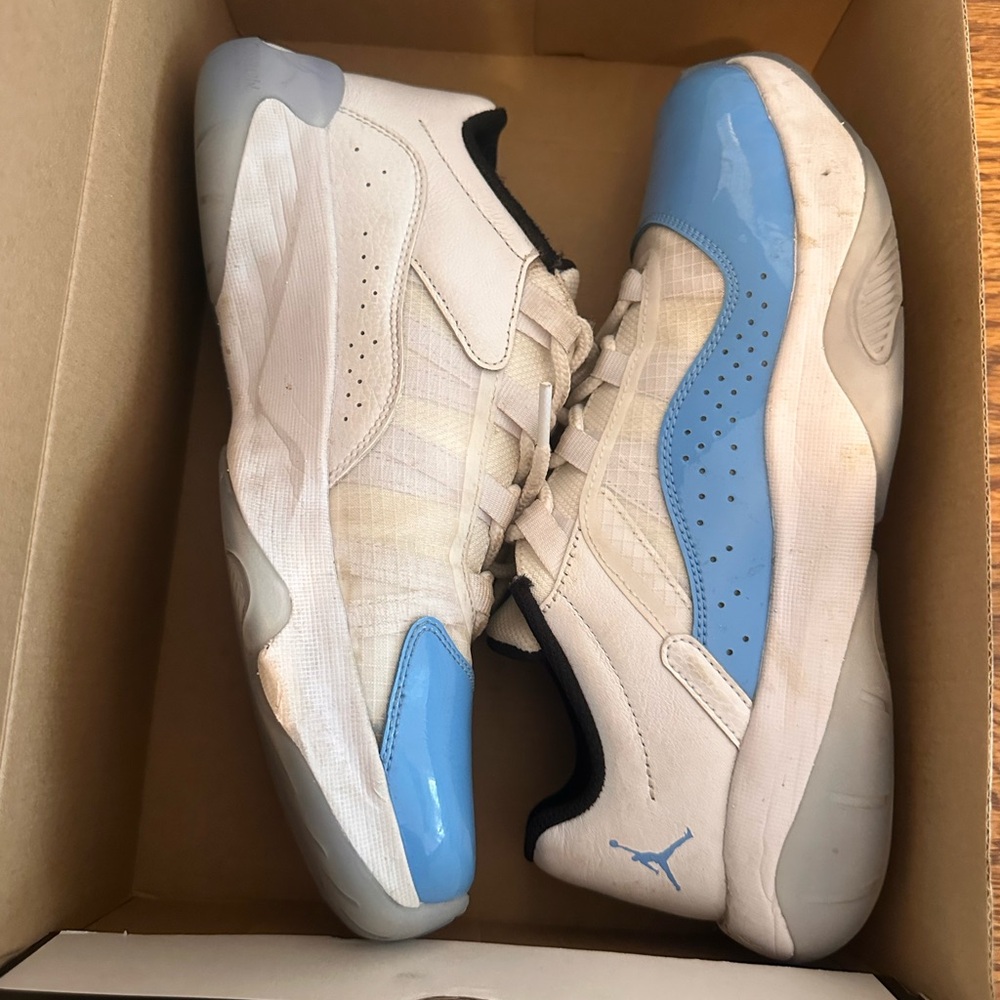 Jordan White and Blue Athletic Shoes with Modern Silhouette